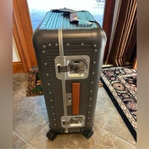 FPM Milano, medium aluminum and leather 26 inch check spinner suitcase Italy